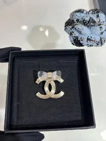 Chanel transparent acrylic bow gold double C brooch-3751